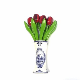 small wooden tulips in red in a Delft blue vase