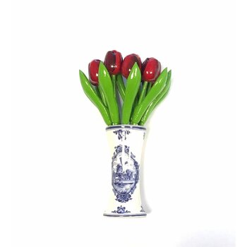 small wooden tulips in red in a Delft blue vase
