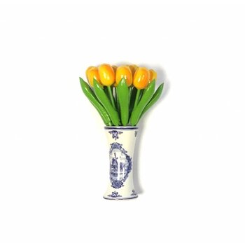 small wooden tulips in yellow in a Delft blue vase