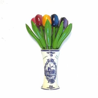 small wooden tulips in a Delft blue vase with logo