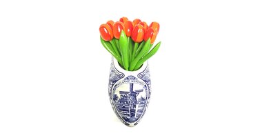 small wooden tulips in a wall vase