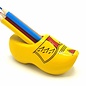 Clog sharpener yellow with stripes with colored pencils.