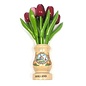 mixed red wooden tulips in a transparent wooden vase