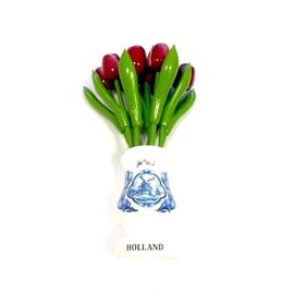 Mixed red wooden tulips in a white wooden vase