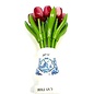 Red-white wooden tulips in a white wooden vase