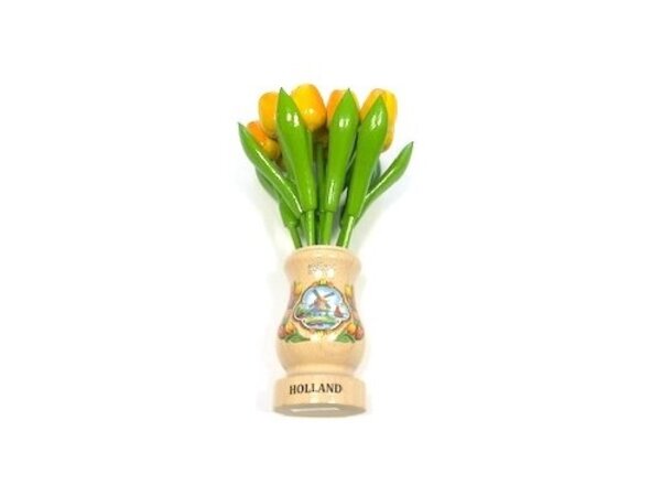Yellow wooden tulips in a transparent wooden vase