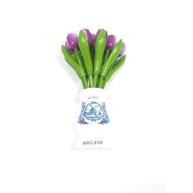 Purple wooden tulips in a white wooden vase