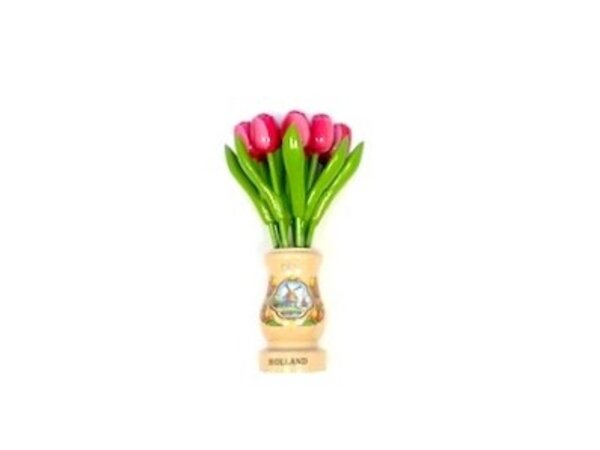 Pink-white wooden tulips in a transparent wooden vase