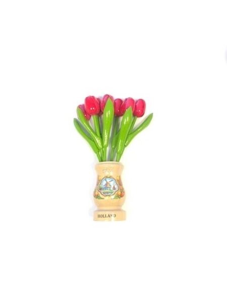 Pink wooden tulips in a transparent wooden vase