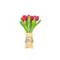 Pink wooden tulips in a transparent wooden vase