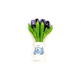 Dark purple wooden tulips in a white wooden vase