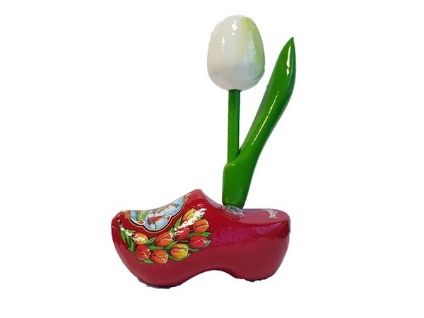 Witte houten tulpje op een rood souvenir klompje