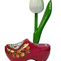 White wooden tulip on a souvenir clog