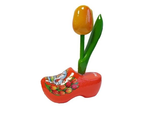 Gele houten tulpje op een oranje klomp