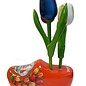 wooden tulips on an orange clog