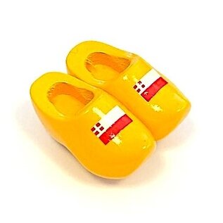 Souvenir clogs on a magnet with flag