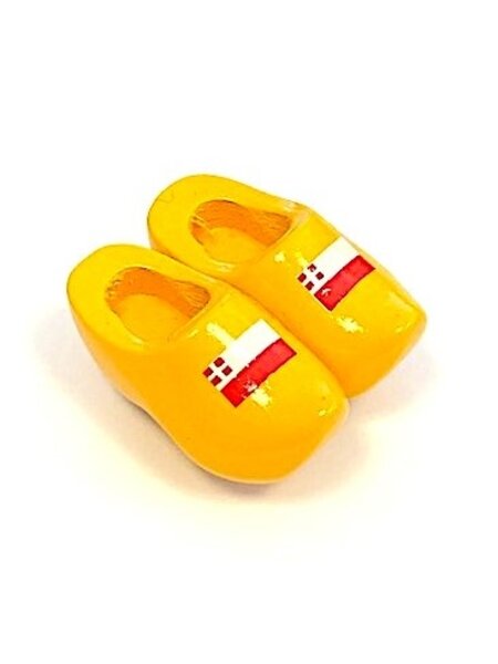 Souvenir clogs on a magnet with flag