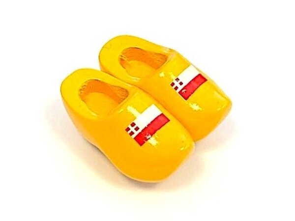 Souvenir clogs on a magnet with flag
