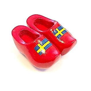 Souvenir clogs on a magnet with flag