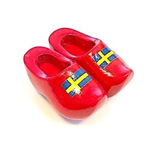 Souvenir clogs on a magnet with flag
