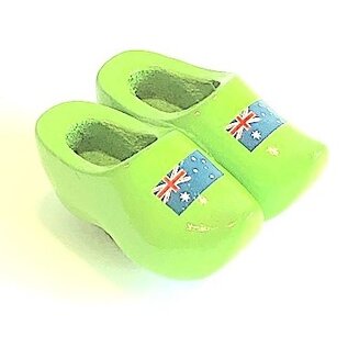 Souvenir clogs on a magnet with flag