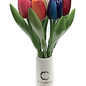 Large wooden tulips in a wooden vase with logo