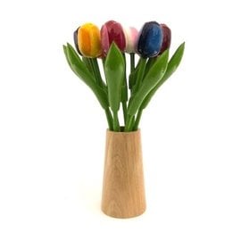 Large wooden tulips in a wooden design vase