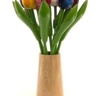 Large wooden tulips in a wooden design vase