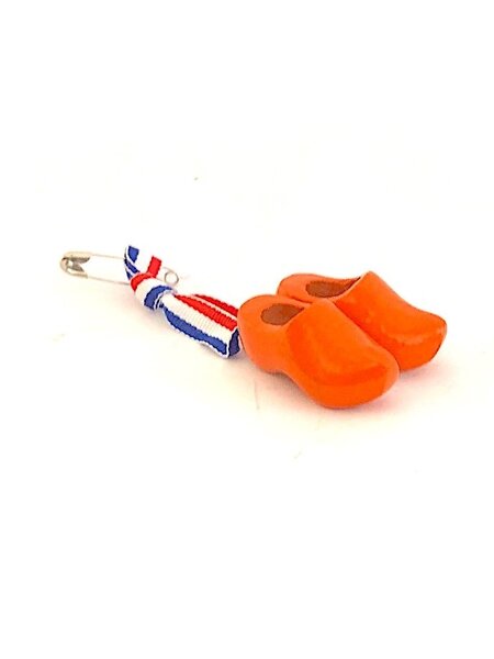 Corsage with orange clogs