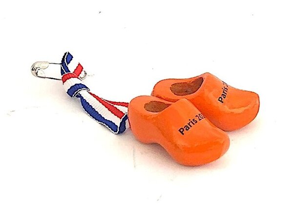 Corsage met oranje klompjes met tekst