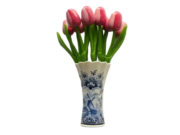 Rosa -weiße Holztulpen in einer Delfter-blauen Vase
