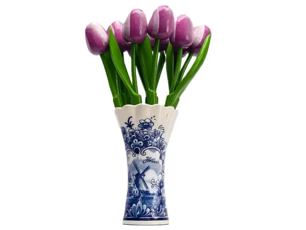 Purple wooden tulips in a Delft blue vase