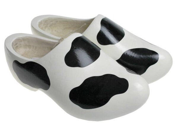 White children's wooden shoes with cow spots White children's wooden shoes with cow spots