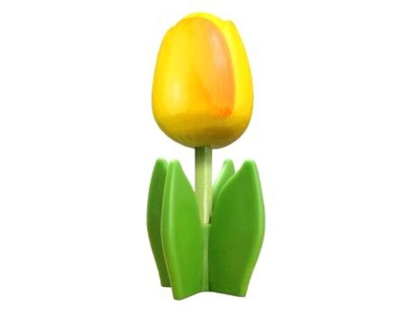 Gelbe Tulpe aus Holz auf einem Blatt