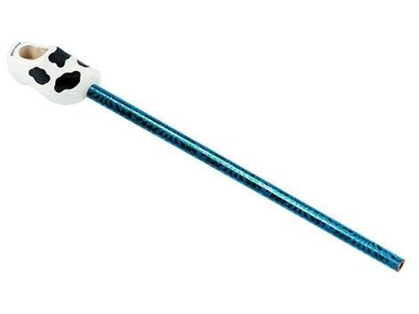 White souvenir clog on a pencil with cow spots