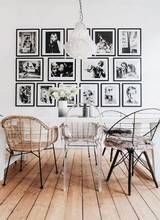 A playful mix of chairs and photo frames and an original light fixture that fits your personal taste! - seen at Pinterest