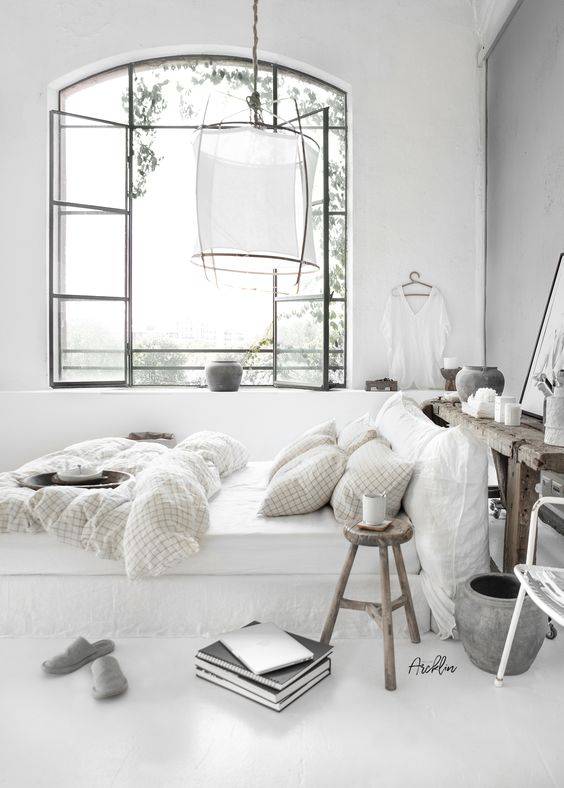 A bedroom  style that is white and bright spotted at 