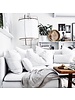 Un décor net et blanc, avec des pièces uniques chaleureuses et un textile doux et confortable