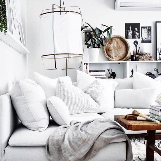 A clean, white decor, with warm characteristic unique pieces and comfy soft textile