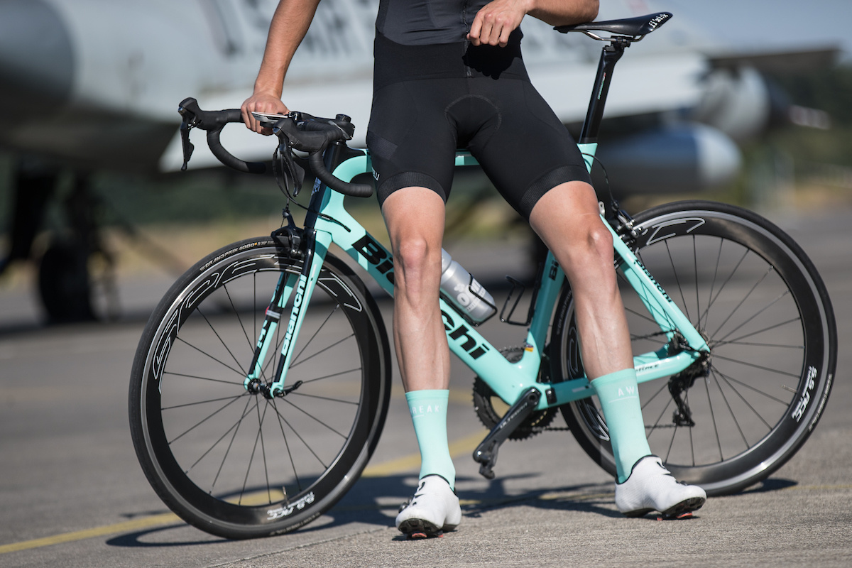 Cycler showing off his light blue long cycling socks