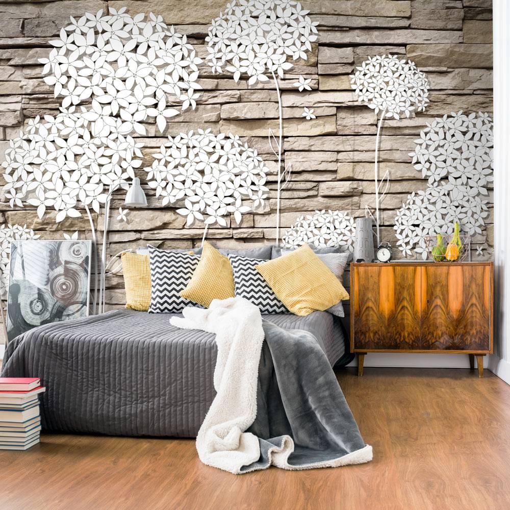 Fotobehang - Bloemen op de muur afbeelding