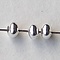 Metalen kraaltje. Rondelle. 2x3mm. Silverplated.