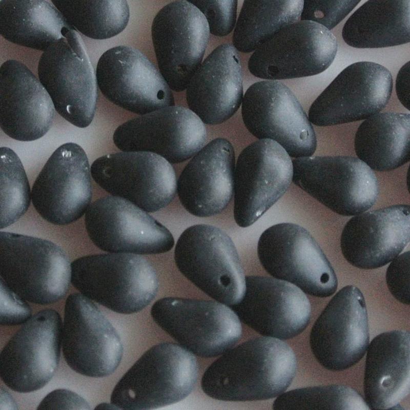 Glass bead drop. 5x7mm. The matt black hole sits at the top of the bead. 100 pieces for.