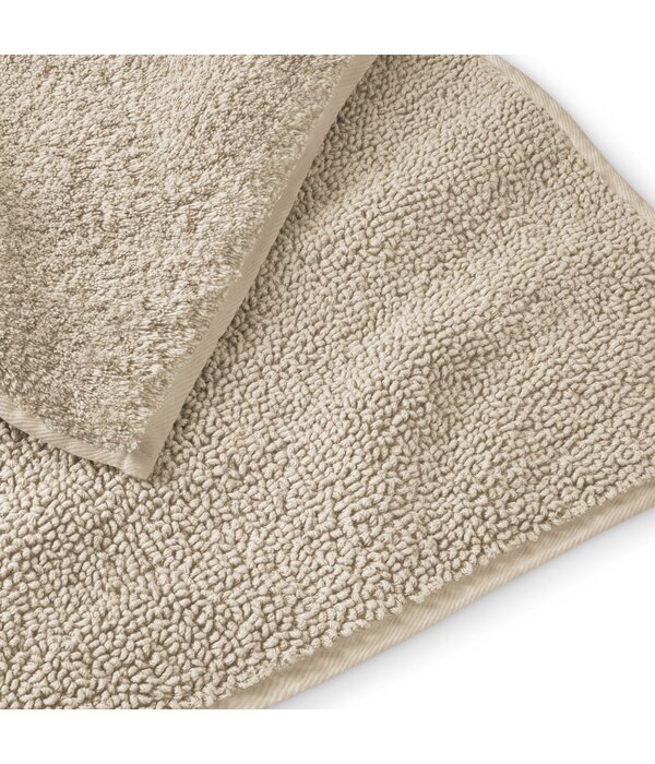 Schlossberg badmattenlijn Coshmere sand GOTS biologisch katoen