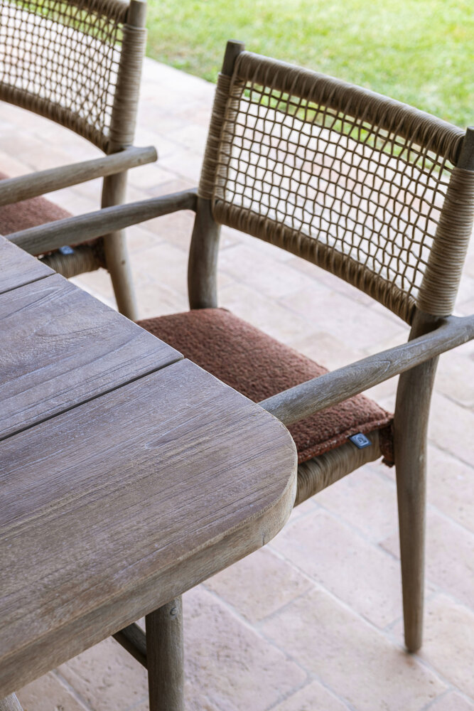 GOMMAIRE Outdoor | Organic Living Stackable Armchair Mieke | Teak Natural Grey / PE Wicker Sand