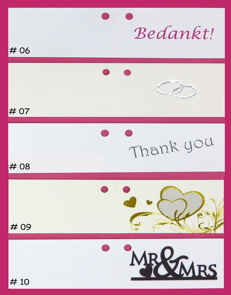 Wit organza zakje versierd met gelukspoppetjes