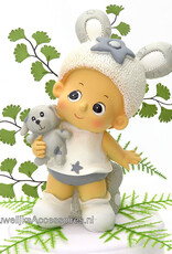 Leuke schattige taarttopper baby met een knuffel