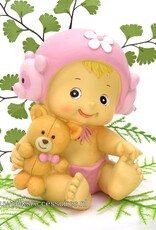 Geboorte taarttopper baby meisje zit met een knuffel