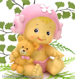 Roze meisje taarttopper met een knuffel
