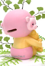 Geboorte taarttopper baby meisje zit met een knuffel